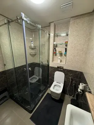 a bathroom with a shower and a toilet and a sink at Maison Privée avec Sauna Marrakech in Chouiter