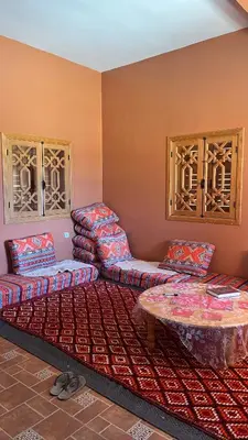 a living room with couches and a table at Villa Syam in Tiflet