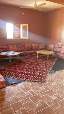 a living room with a couch and a table at Villa Syam in Tiflet