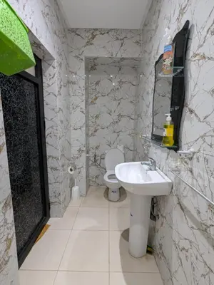 a bathroom with a toilet and a sink at Villa moulay abdella in Marrakech