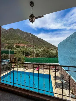 a view of a swimming pool from a balcony at Blue Atlas Villa in Igrif Foudene