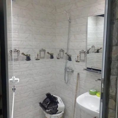 a bathroom with a shower and a toilet and a sink at ديار البوغاز in Oulad Akkou
