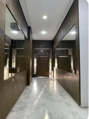 a lobby with a hallway with a door and mirrors at Appartement avec vue sur Parc champs de course et Wifi 200 Mo in Oulad Akkou