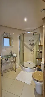 a bathroom with a shower and a toilet and a sink at Apartamentos rent me in Oulad Akkou