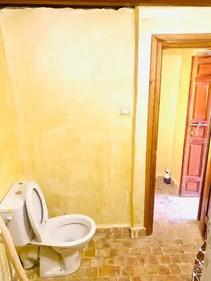 a bathroom with a toilet in a room at Dar cheikh in Fès