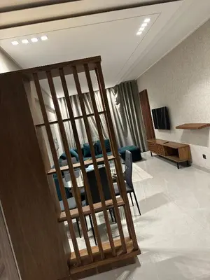 a living room with a bed in a room at Studio haut standing in Oulad Akkou