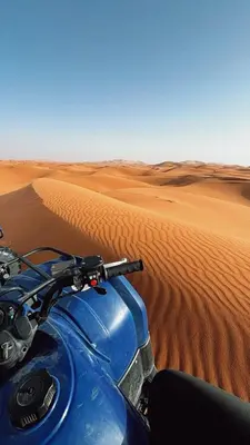 a motorcycle in the middle of the desert at Merzouga heritage camp in Merzouga