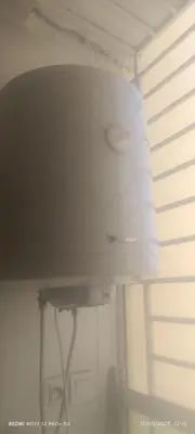 a white light hanging from a ceiling in a room at appartement familial in Oulad Akkou