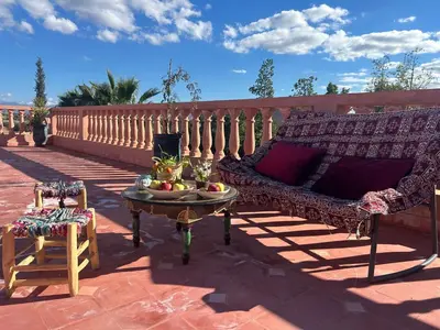 a couch and a table on a patio at Villa Essalah & Spa Marrakech in Marrakech