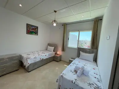 a bedroom with two beds and a window at 