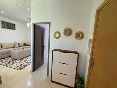 a living room with a mirror and a couch at 