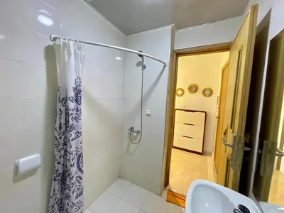a bathroom with a shower and a sink at 