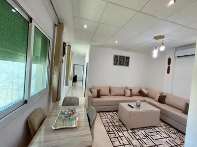 a living room with a couch and a table at 