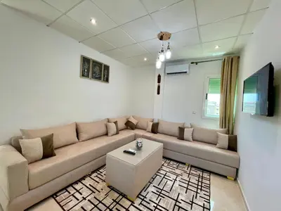 a living room with a couch and a table at 