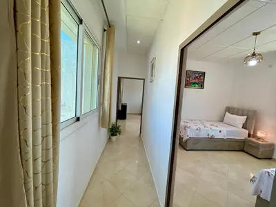 a bedroom with a bed and a large window at 