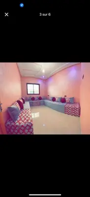 a living room with two couches and a couch at Apparemment bien entretenu in Meknès