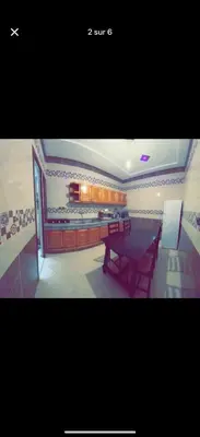 a picture of a dining room with a table at Apparemment bien entretenu in Meknès