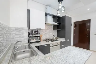 a kitchen with a sink and a counter top at Basharly in Oulad Akkou