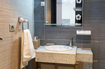 a bathroom with a sink and a mirror at Basharly in Oulad Akkou