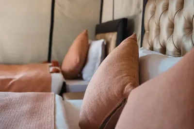 a close up of pillows on a bed at Sahara Luxurious Tented in Merzouga