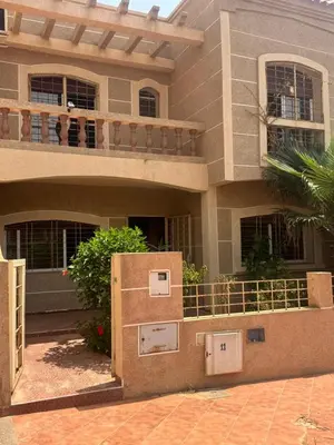 a house with a box in front of it at Petite villa à cap de l eau in Oulad Akkou