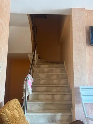 a set of stairs in a house at Petite villa à cap de l eau in Oulad Akkou