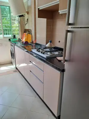 a kitchen with a stove and a counter top at Maison heureuse Vue magnifique très proche autoroute in Meknès
