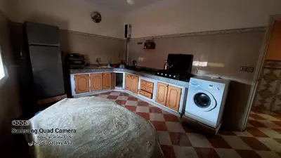 a kitchen with a washer and a washing machine at شقق محمد in Oulad Akkou