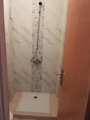 a bathroom with a shower with a toilet at Alhoceima in Oulad Akkou