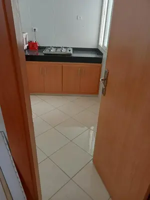 an open door to a kitchen with a sink at Alhoceima in Oulad Akkou