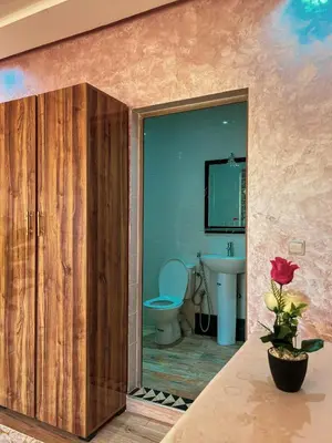 a bathroom with a toilet and a sink at Ourika Luxury Villa in Ourika