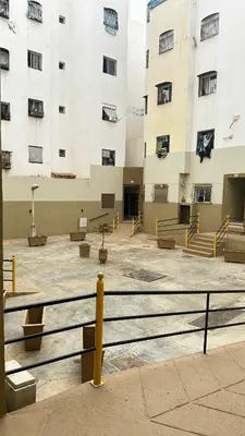 a large building with stairs in front of it at Elmaghouss in Oulad Akkou