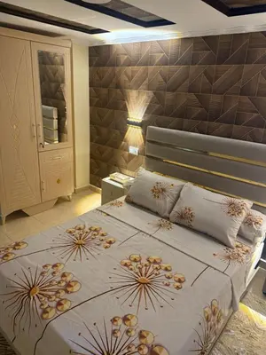 a bedroom with a large bed with pillows on it at Descanso ideal en Nador in Oulad Akkou