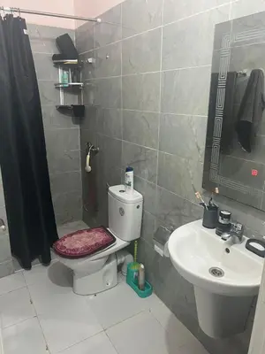 a bathroom with a toilet and a sink at dakhla extreme in Oulad Akkou