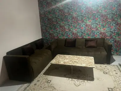 a living room with a couch and a table at dakhla extreme in Oulad Akkou