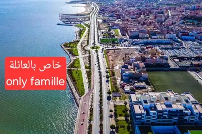 an aerial view of a highway next to the ocean at Bousstan 1er in Oulad Akkou