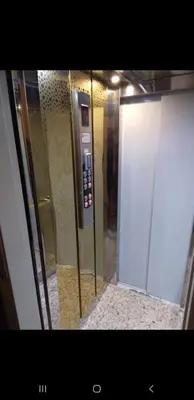 a elevator with a control panel in a room at Bousstan 1er in Oulad Akkou