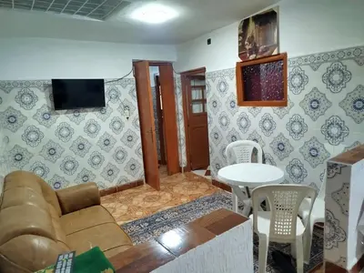 a living room with a couch and a table at Appartement REDA in Oulad Akkou