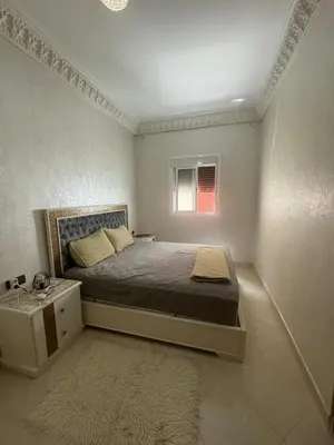 a small bedroom with a bed and a window at Welcome to Tangier in Oulad Akkou