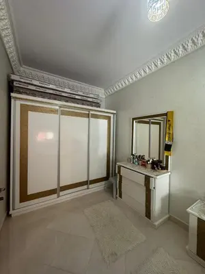 a large room with a mirror and a dressing room at Welcome to Tangier in Oulad Akkou