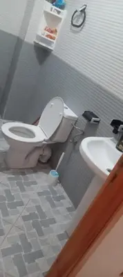 a bathroom with a toilet and a sink at Dar mustapha in Oulad Akkou