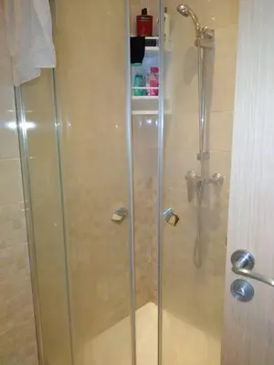 a shower with a glass door in a bathroom at BOUZNIKA shems premium in Oulad Akkou