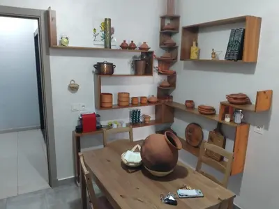 a room with a table with a pot on it at Appartement moderne - Marrakech in Oulad Akkou