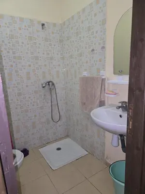 a bathroom with a shower and a sink at caprice apparemment in Ifrane