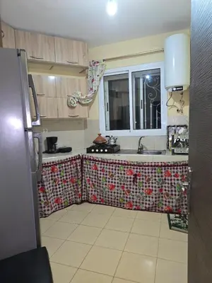 a small kitchen with a sink and a window at caprice apparemment in Ifrane