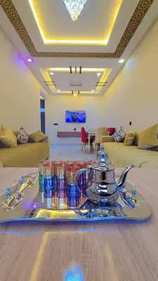 a living room with a tray of drinks on a table at Luxuriöse Wohnung in Fez in Fès