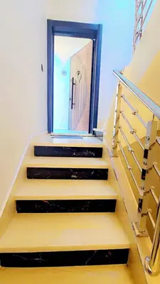 a mirror on the side of a door on the stairs at Luxuriöse Wohnung in Fez in Fès