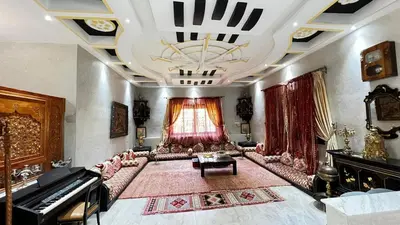 a living room with a couch and a piano at Intimate villa Private pool et Atlas view in Sidi Bouzguia