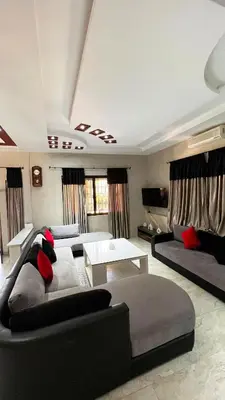 a large living room with couches and a table at Intimate villa Private pool et Atlas view in Sidi Bouzguia