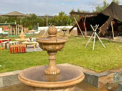 a fountain in the middle of a park at Villa sans vis à vis Lina in Marrakech